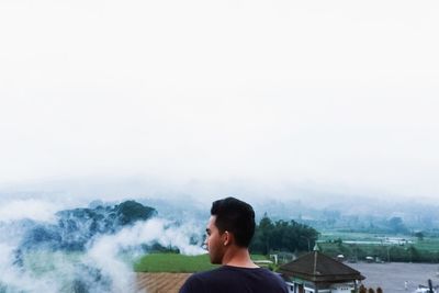 Man on mountain against sky