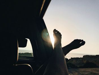Silhouette man against sky during sunset