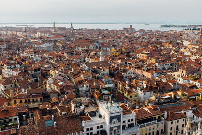 Townscape and sea against sky