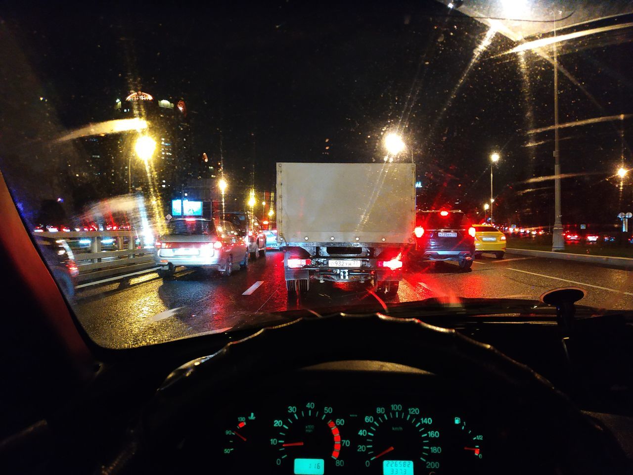 CITY STREET SEEN THROUGH CAR WINDSHIELD