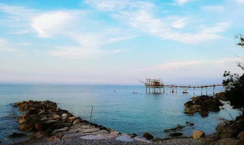 Scenic view of sea against cloudy sky