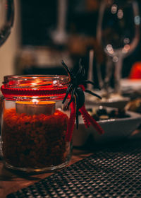 Close-up of crab in glass jar on table