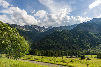 Scenic view of landscape and mountains against sky