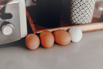 Close-up of eggs in container on table