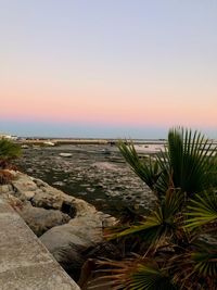 Scenic view of sea against clear sky during sunset