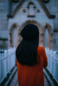 Rear view of woman standing outdoors