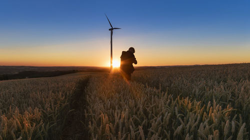 Scenic view of field against sky during sunset