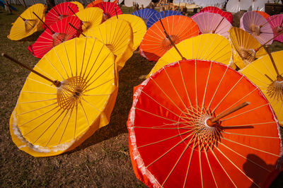 Close-up of multi colored umbrellas at market stall