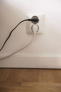 Plugs in wall outlet