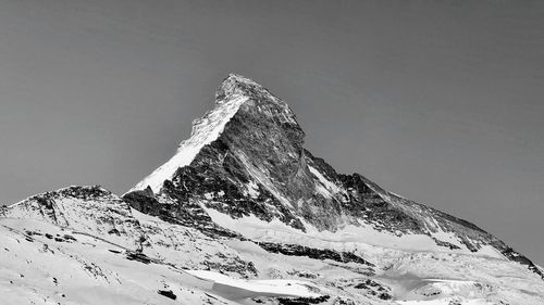 Scenic view of snowcapped mountain against sky