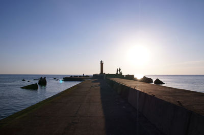 Scenic view of sea and clear sky during sunset