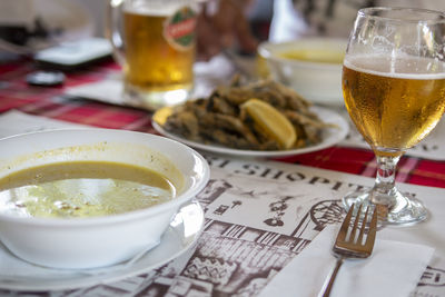 Close-up of beer glass on table