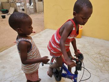 Rear view of boy riding bicycle