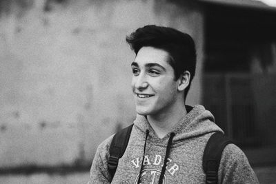 Portrait of young man standing outdoors