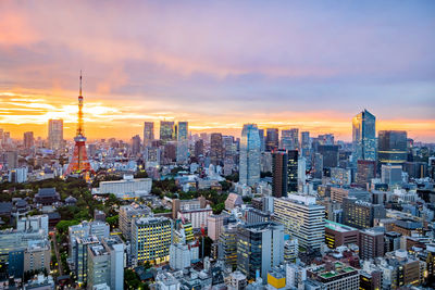 Cityscape against sky during sunset