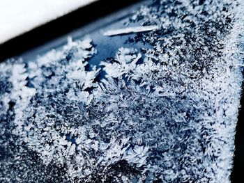 Close-up of snow on glass