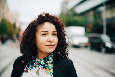 Portrait of beautiful woman in city