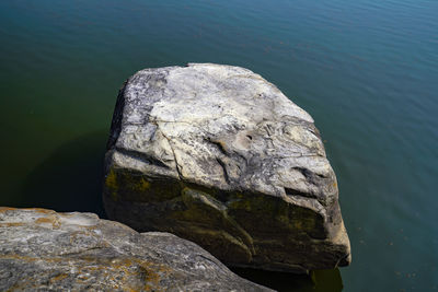 Close-up of rock, so called euiam by lake