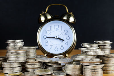 Close-up of clock against black background