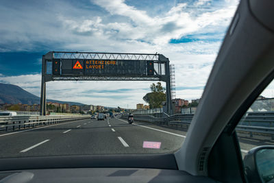 Road seen through car windshield