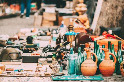 Various container displayed for sale at market stall