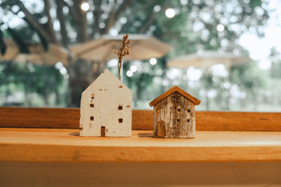 Close-up of toy on table against building