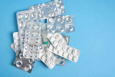 Close-up of mannequin against blue background