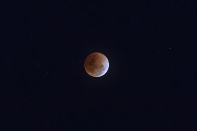 Scenic view of moon against clear sky at night