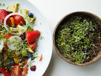 High angle view of chopped fruits in bowl on table