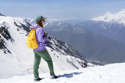 Man standing on snowcapped mountain