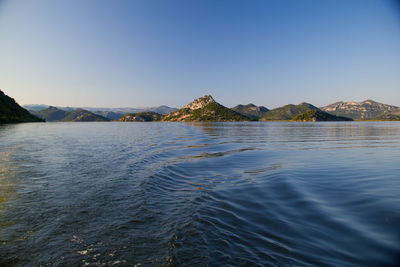 Scenic view of sea against clear blue sky