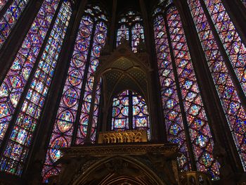 Low angle view of stained glass window of building