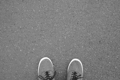 Low section of person standing on street