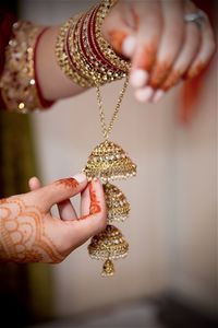 Close-up of woman holding golden ornaments