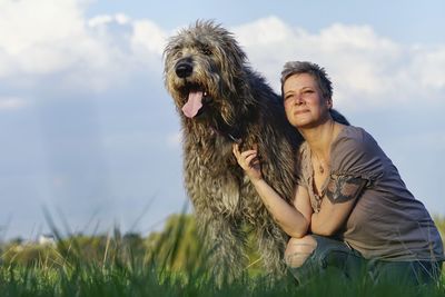 Portrait of woman with irish wolfhound