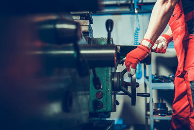 Low section of man working at workshop