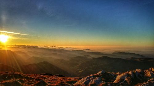 Scenic view of mountains against sky during sunset