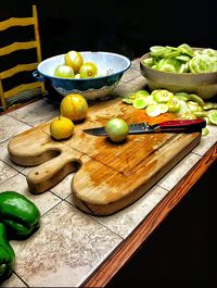 Vegetables with knife on table at home