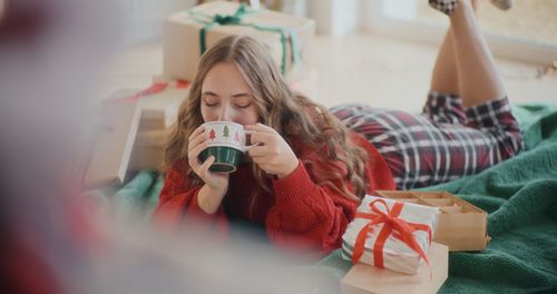 Portrait of smiling young woman using mobile phone