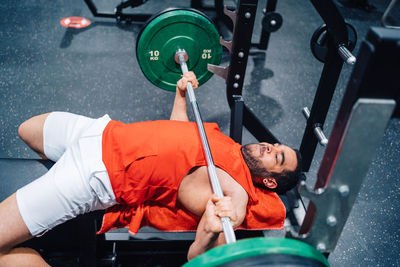 High angle view of boy playing in gym