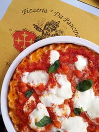 High angle view of pizza served on table