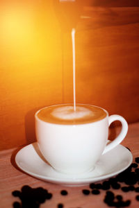 Close-up of coffee cup on table