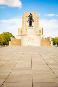 Statue of historic building against sky