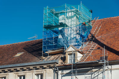 Low angle view of building against clear blue sky