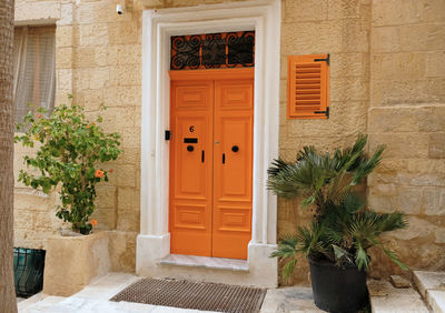 Traditional vintage painted wooden door and exterior in malta. entrance to typical maltese houses.