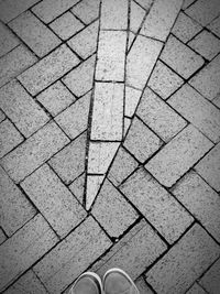 High angle view of shoes on footpath