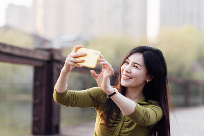 Young woman using mobile phone