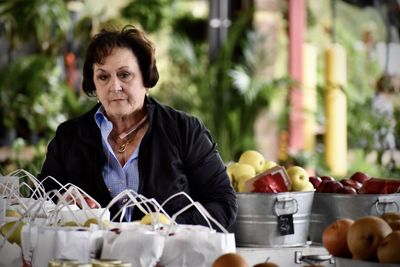 Portrait of woman with fruits