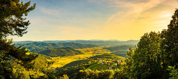 Scenic view of landscape against sky during sunset