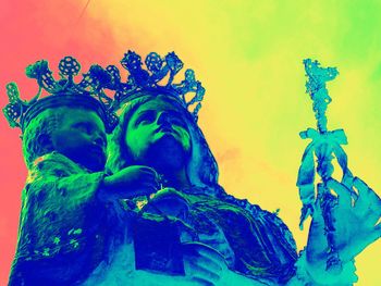 Low angle view of statue against blue sky